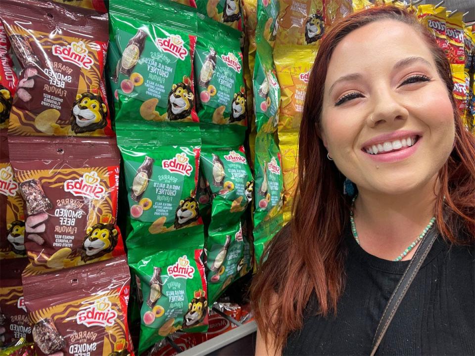 Megan Gieske smiling in front of chips in south africa