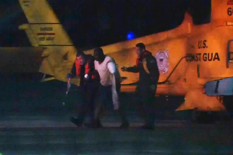 Injured people from a clinic in Great Abaco Island's Marsh Harbour arrive after being evacuated in a U.S. Coast Guard helicopter to be treated in Nassau, Bahamas in a still image from video September 2, 2019. REUTERS/Rodrigo Gutierrez