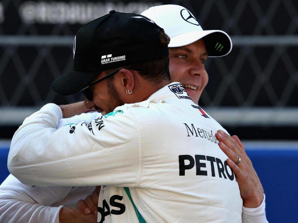 Hamilton congratulates his partner after securing pole (Getty)