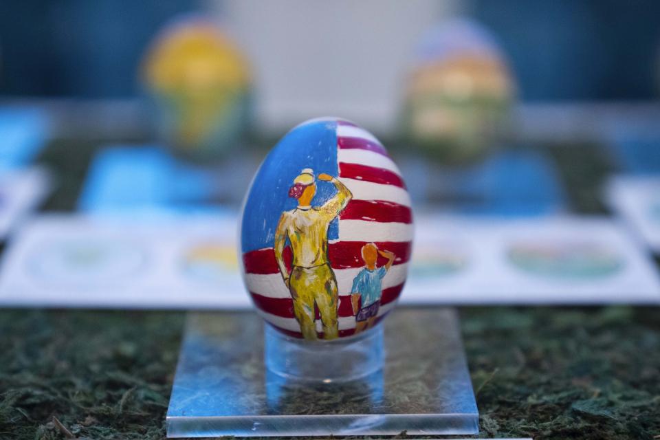 Eggs designed by children of members of the military adorn the East Colonnade of the White House ahead of the White House Easter Egg Roll, Thursday, March 28, 2024, in Washington. (AP Photo/Evan Vucci)