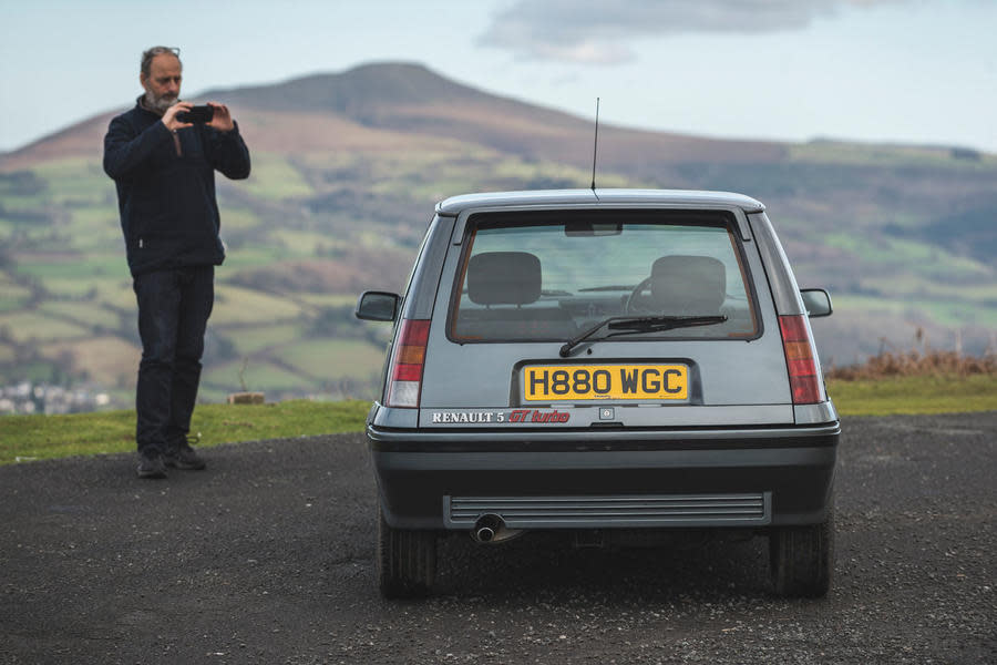 Andrew Frankel taking a phone picture of a Renault 5 GT Turbo