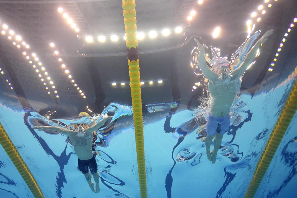 Zac Stubblety-Cook, left, of Australia, and Qin Haiyang, of China, compete in the men's 200-meter breaststroke final at the World Swimming Championships in Fukuoka, Japan, Friday, July 28, 2023. Qin finished first and Stubblety-Cook finsished second. (AP Photo/David J. Phillip)