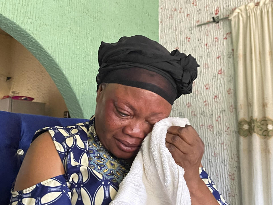 Mary Peter, mother of Jennifer Peter, who was kidnapped with others in her school by gunmen in March 2021, sobs during an interview with The Associated Press in Kaduna, Nigeria, Tuesday, March, 26, 2024. The gunmen who kidnapped Jennifer Peter and dozens of her peers from school in March 2021 returned months later to attack another school in her state in northwestern Nigeria. The second time, they seized over 100 children including Jennifer's 10-year-old cousin, Treasure, who was held captive for more than two years. (AP Photo/Chinedu Asadu)