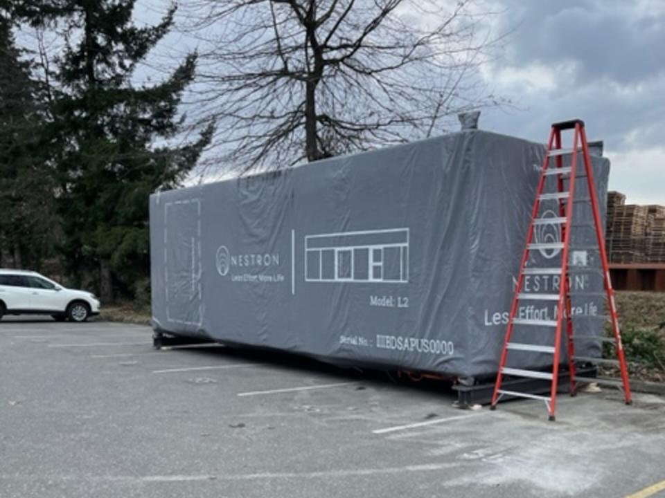 Nestron's tiny home under wraps outside