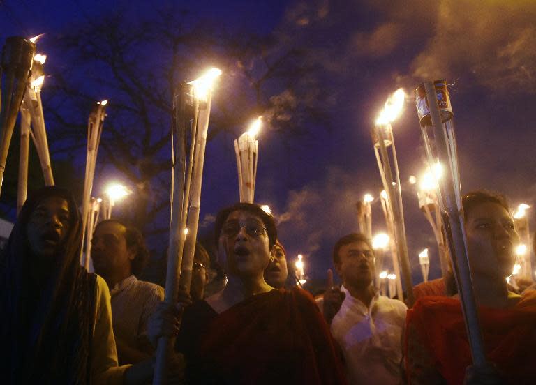 Bangladeshi secular activists take part in a torch-lit protest against the killing of Avijit Roy, a blogger who was hacked to death, in Dhaka, on February 27, 2015