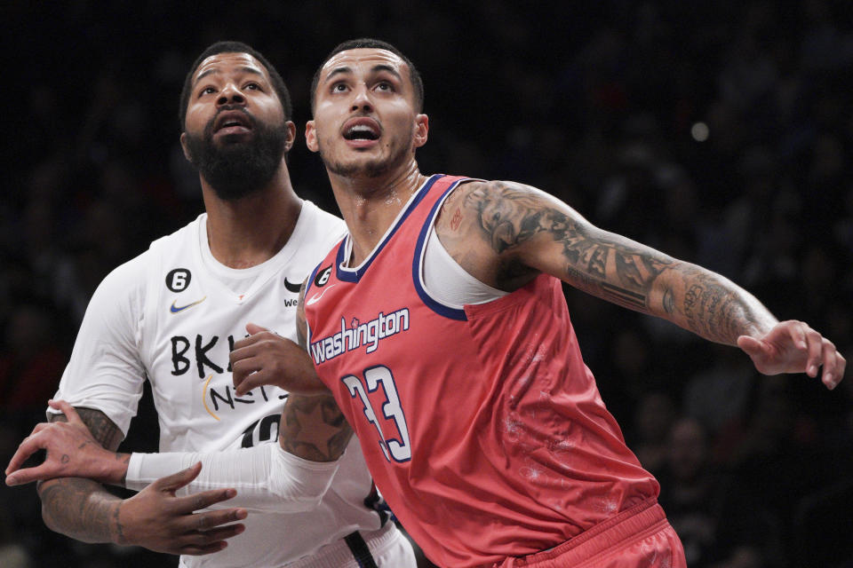 Brooklyn Nets forward Markieff Morris, left, and Washington Wizards forward Kyle Kuzma jostle for a rebound during the first half of an NBA basketball game, Saturday, Feb. 4, 2023, in New York. (AP Photo/Bebeto Matthews)