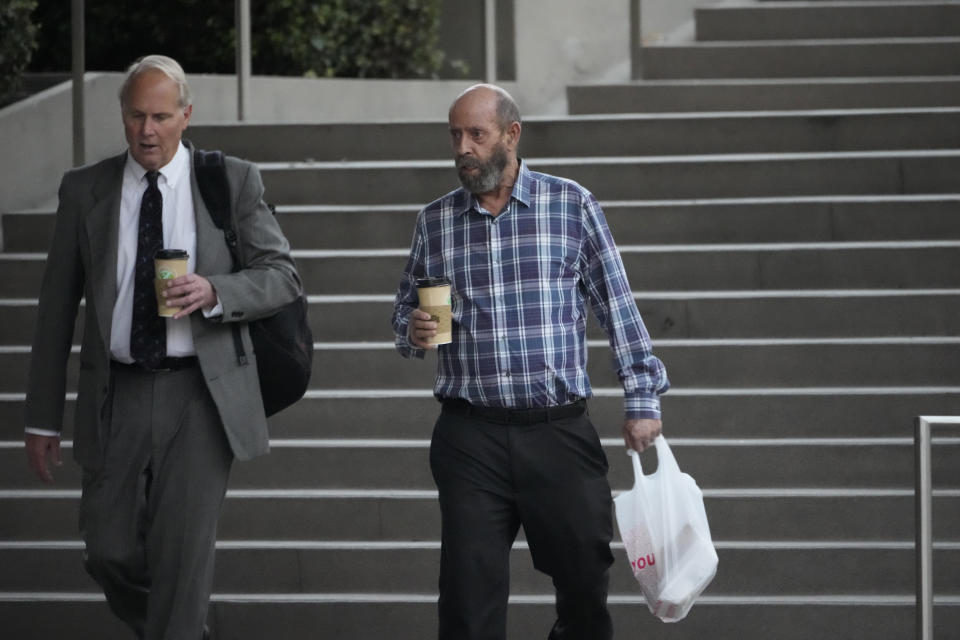 FILE - Defendant Jerry Boylan, captain of the Conception, right, arrives at federal court in Los Angeles, Wednesday, Oct. 25, 2023. The scuba dive boat captain is scheduled to be sentenced by a federal judge Thursday, May 2, 2024, on a conviction of criminal negligence after 34 people died in a fire aboard the vessel nearly five years ago. (AP Photo/Damian Dovarganes, File)