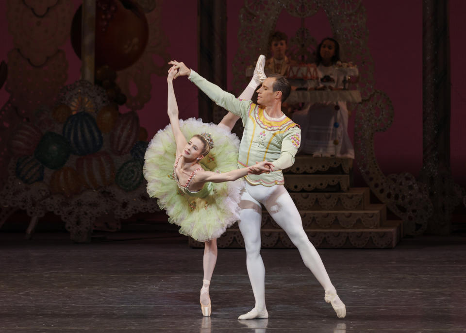 This image released by the New York City Ballet shows principal dancer Sterling Hyltin as the Sugarplum Fairy, left, and Andrew Veyette as her Cavalier in George Balanchine's "The Nutcracker," in New York on Dec. 4, 2022. (Erin Baiano/New York City Ballet via AP)