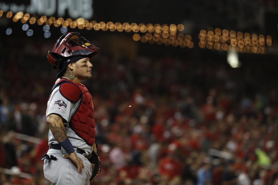 St. Louis Cardinals catcher Yadier Molina pauses during the second inning of Game 4 of the baseball National League Championship Series against the Washington Nationals Tuesday, Oct. 15, 2019, in Washington. (AP Photo/Jeff Roberson)