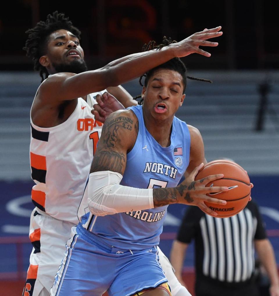 North Carolina Tar Heels forward Armando Bacot (5) works on getting offensive position on Syracuse Orange forward Quincy Guerrier (1) in a game between Syracuse and North Carolina at the Carrier Dome in Syracuse N.Y. March 1, 2021. Dennis Nett | dnett@syracuse.com