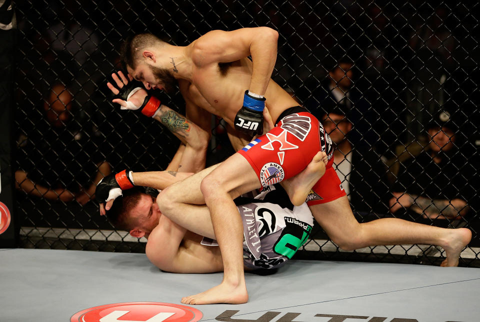 SAN JOSE, CA - APRIL 20:   Jorge Masvidal (top) punches Tim Means in their lightweight bout during the UFC on FOX event at the HP Pavilion on April 20, 2013 in San Jose, California.  (Photo by Ezra Shaw/Zuffa LLC/Zuffa LLC via Getty Images)