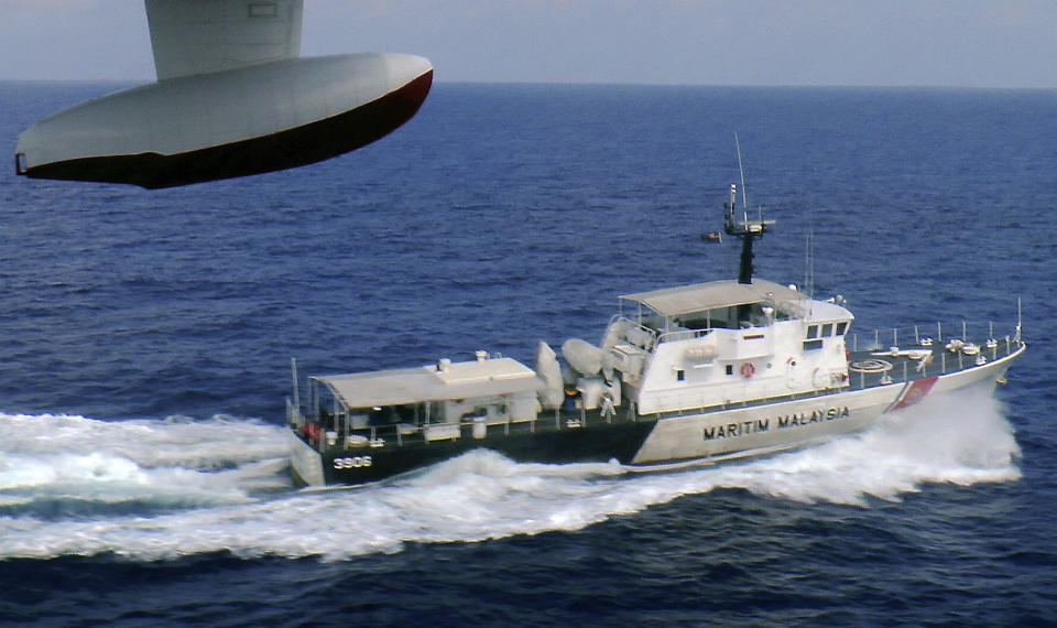 In this photo released by Malaysian Maritime Enforcement Agency, a patrol vessel of Malaysian Maritime Enforcement Agency searches for the missing Malaysia Airlines plane off Tok Bali Beach in Kelantan, Malaysia, Sunday, March 9, 2014. Military radar indicates that the missing Boeing 777 jet may have turned back, Malaysia’s air force chief said Sunday as scores of ships and aircraft from across Asia resumed a hunt for the plane and its 239 passengers. (AP Photo/Malaysian Maritime Enforcement Agency)