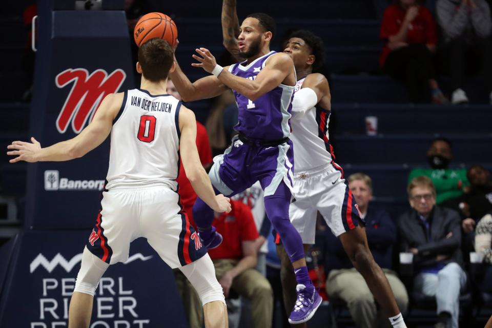 Kansas State guard Markquis Nowell (1) passes the ball as Ole Miss' Luis Rodriguez (15) defends Saturday during the first half at the Pavilion at Ole Miss.
