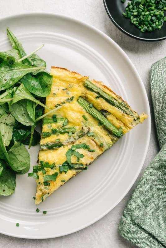 Our Salty Kitchen<p>Make the perfect asparagus frittata is just 30 minutes. Featuring a handful of simple, fresh ingredients, it’s excellent for light meals like lunch and brunch or make-ahead meal prep.</p><p><strong>Get the recipe: <a href="https://oursaltykitchen.com/asparagus-frittata/" rel="sponsored" target="_blank" data-ylk="slk:Asparagus Frittata;elm:context_link;itc:0;sec:content-canvas" class="link "><em>Asparagus Frittata</em></a></strong></p>