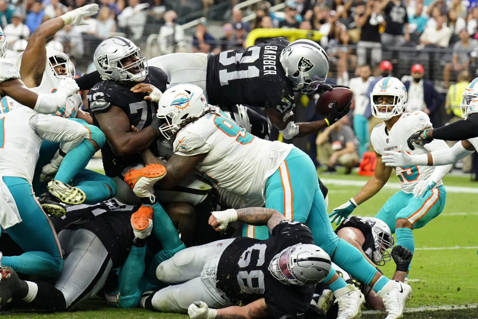 Las Vegas Raiders running back Peyton Barber (31) dives in for a touchdown against the Miami Dolphins during the second half of an NFL football game, Sunday, Sept. 26, 2021, in Las Vegas. (AP Photo/Rick Scuteri)