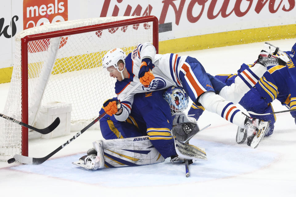 Edmonton Oilers right wing Corey Perry (90) is stopped by Buffalo Sabres goaltender Ukko-Pekka Luukkonen (1) during the third period of an NHL hockey game Saturday, March 9, 2024, in Buffalo, N.Y. (AP Photo/Jeffrey T. Barnes)