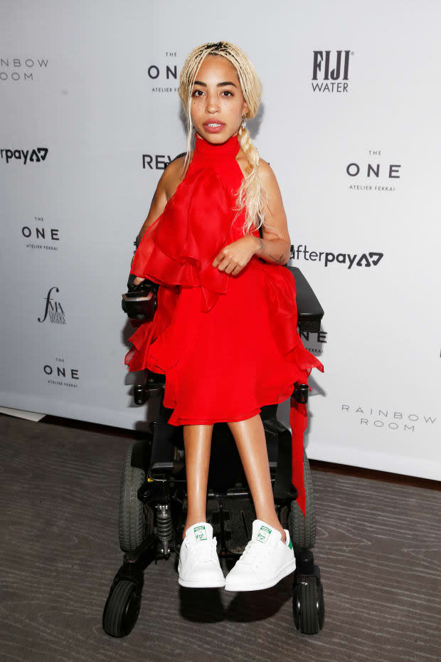 Mercado at the 2019 Daily Front Row Fashion Media Awards, wearing Redemption Official and Adidas. 