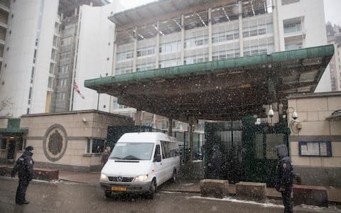 A convoy of vehicles leaves the British embassy in Moscow on Friday morning - Credit: Pavel Golovkin /AP