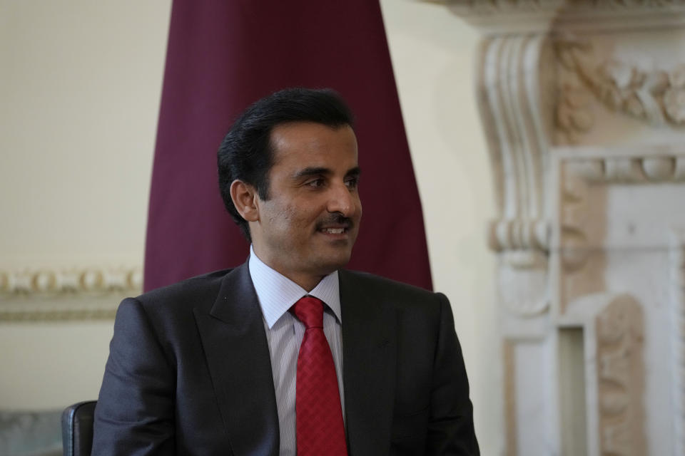 FILE - The Amir of Qatar Sheikh Tamim bin Hamad Al Thani listens to British Prime Minister Boris Johnson at the start of their meeting inside 10 Downing Street, in London, Tuesday, May 24, 2022. Qatar’s emir arrived in Cairo late Friday, June 24, to hold talks with Egypt's president in his first visit since the two countries agreed to reset relations after more than seven years of diplomatic animosity. (AP Photo/Matt Dunham, Pool)