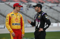FILE - In this March 29, 2019, file photo, Jimmie Johnson, right, chats with Joey Logano before qualifying for the NASCAR Cup Series auto race at Texas Motor Speedway in Fort Worth, Texas. The final three playoff spots are up for grabs as stock-car racing returns to the high-banked superspeedway in Daytona Beach, Fla., two weeks after running the road course. Nearly half the field is looking to clinch a postseason berth with a victory, including seven-time series champion Jimmie Johnson. “A lot of people are desperate,” said Team Penske driver Joey Logano, who's already locked into the playoffs. “Crazy things will happen.” (AP Photo/LM Otero, File)