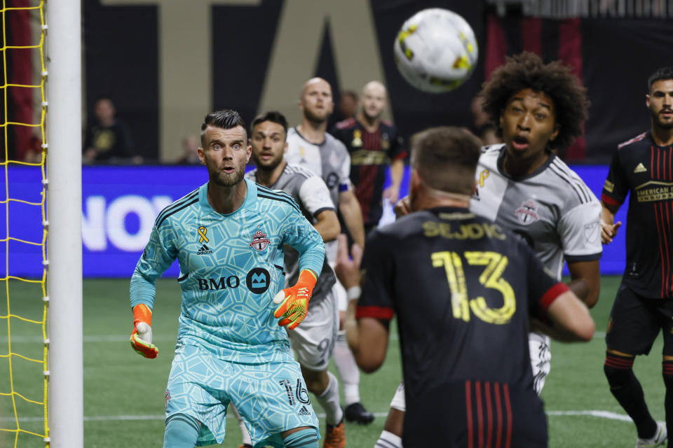 Toronto FC goalkeeper Quentin Westberg (16) cannot defend against a second-half goal by Atlanta United's Juan José Sánchez Purata with an assist from Amar Sejdič (13) during an MLS soccer match Saturday, Sept. 10, 2022, in Atlanta. (AP Photo/Bob Andres)
