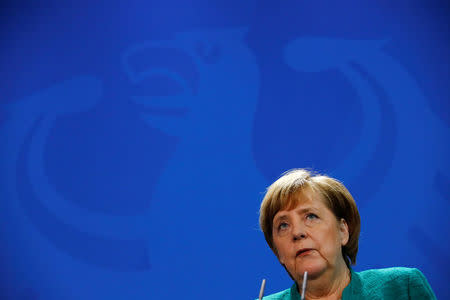 FILE PHOTO - German Chancellor Angela Merkel talks during a news conference with Austria's Chancellor Sebastian Kurz at the Chancellery in Berlin, Germany, January 17, 2018. REUTERS/Fabrizio Bensch