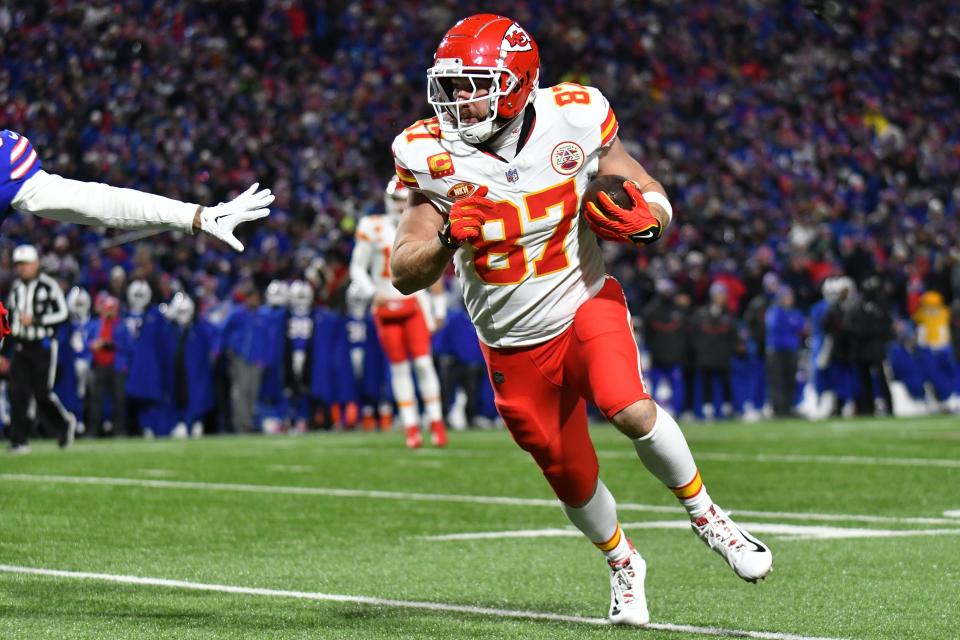 Kansas City Chiefs tight end Travis Kelce (87) runs with the ball after a catch against the Buffalo Bills in the second half of the 2024 AFC divisional round game at Highmark Stadium.