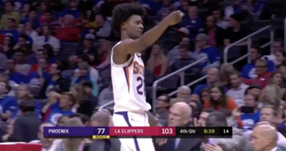 Suns rookie Josh Jackson gestures to a fan at Staples Center. (Screen shot via @TheScore)