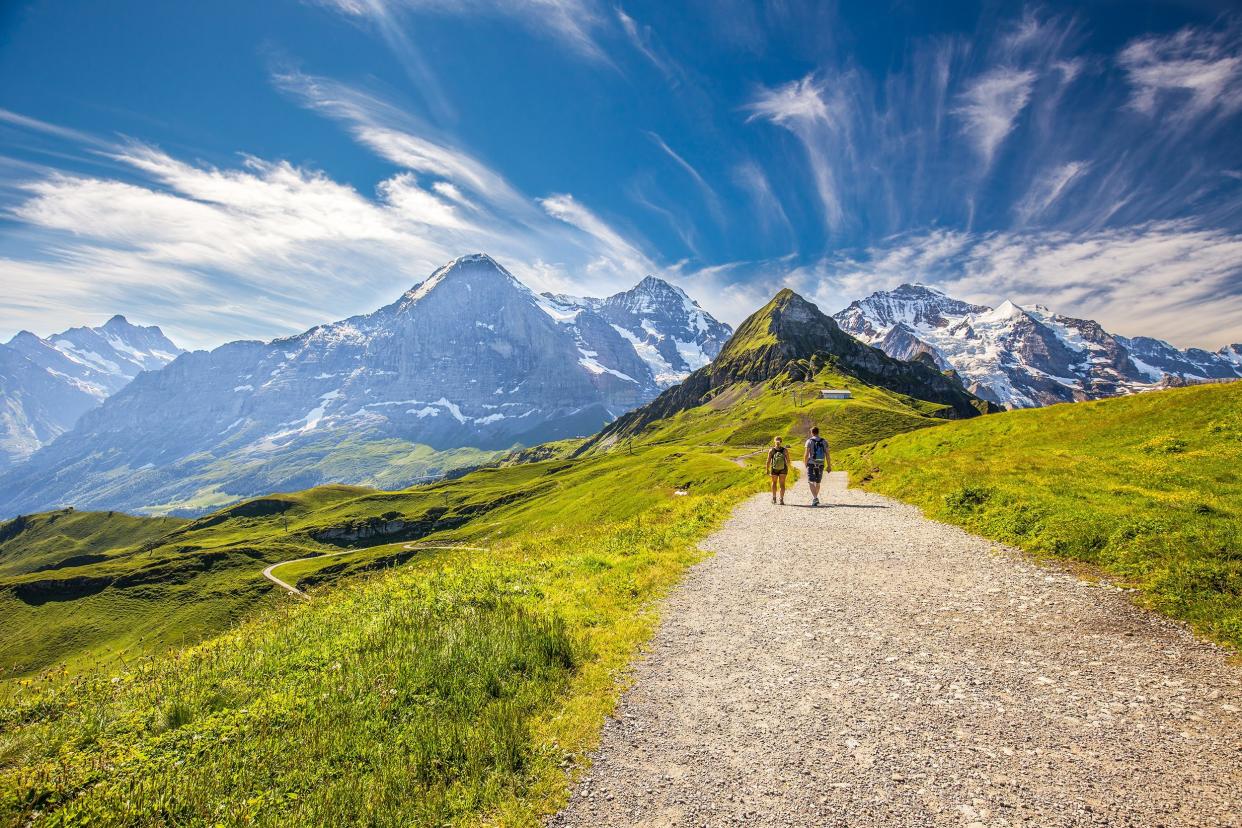 young couple hiking in the Swiss Alps