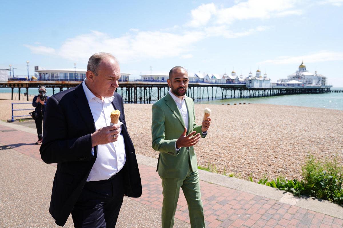 Josh Babarinde with Lib Dem lead Ed Davey enjoying an ice cream in Eastbourne <i>(Image: The Argus/Andrew Gardner)</i>