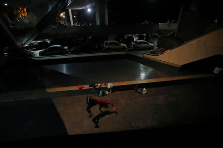 Yeafersonth Manrique whose nickname is B-Boy Chispa practices break dancing at the Teresa Carreno theatre area where he meets friends to dance in Caracas, Venezuela, March 22, 2019. "When we're out here dancing, we don't think about the state of the country," said Yeafersonth Manrique, a 24-year-old drenched in sweat after a long practice. "In this world there is no crisis." REUTERS/Ivan Alvarado