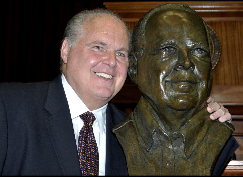 Conservative commentator Rush Limbaugh poses with a bust in his likeness during a secretive ceremony inducting him into the Hall of Famous Missourians on Monday, May 14, 2012, in the state Capitol in Jefferson City, Mo. (AP Photo/Julie Smith)