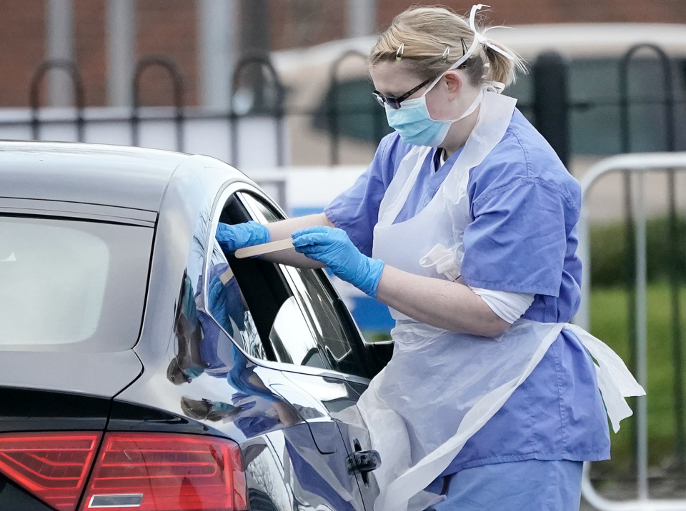 A member of the public is swabbed at a drive through Coronavirus testing site set up in a car park on March 12, 2020 in Wolverhampton, England. (Photo: Christopher Furlong/Getty Images)