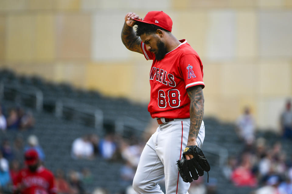 Los Angeles Angels pitcher Jose Marte takes a moment after giving up five runs against the Minnesota Twins during the seventh inning of a baseball game, Sunday, Sept. 24, 2023, in Minneapolis. (AP Photo/Craig Lassig)