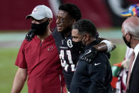 Arizona Cardinals running back Kenyan Drake (41) is helped off the field after an injury during the second half of an NFL football game against the Seattle Seahawks, Sunday, Oct. 25, 2020, in Glendale, Ariz. (AP Photo/Ross D. Franklin)