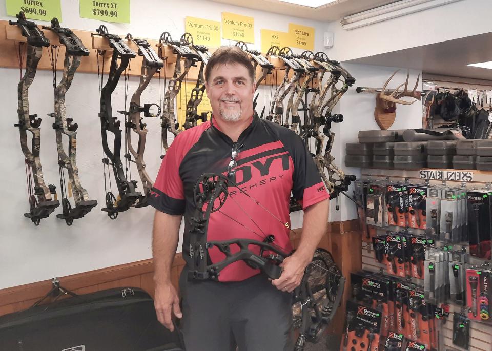 Senior pro archer Tony Tazza with his compound bow at The Archery Zone in Johnstown.