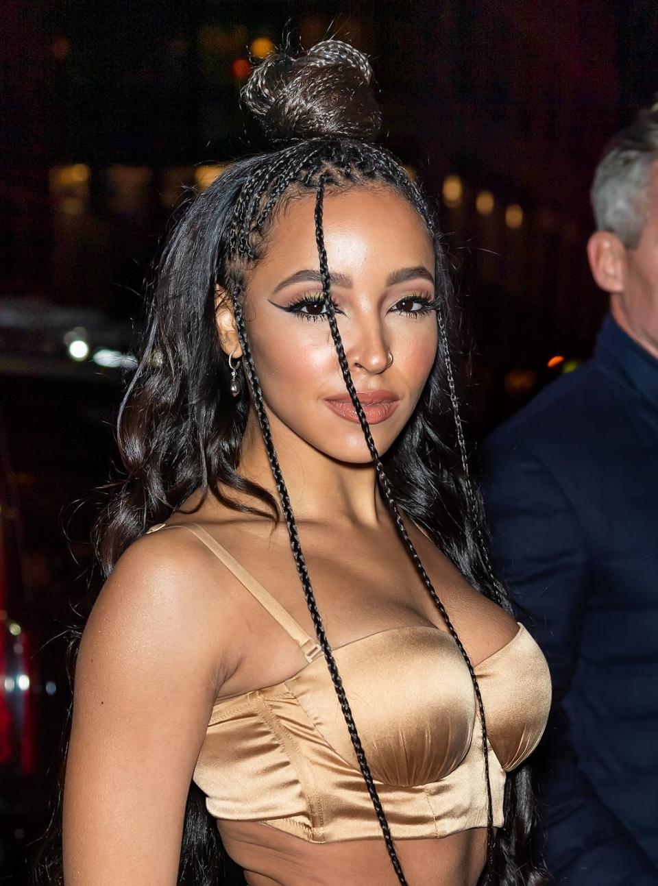 <p>Upgrade your top knot with tiny box braids like singer-songwriter Tinashe.</p>