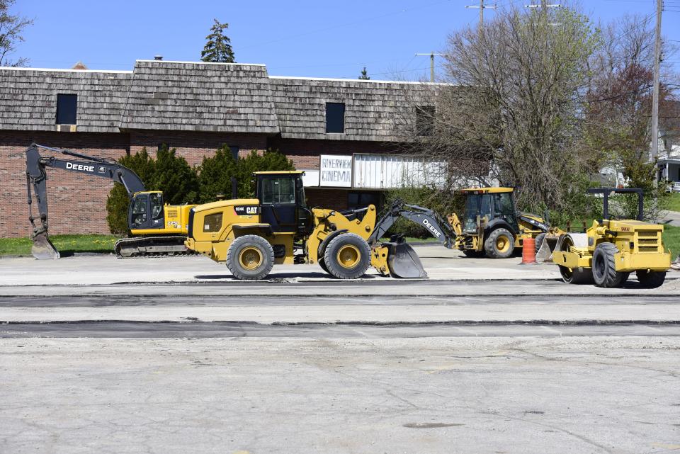 Parked construction vehicles at the reconstruction site of the aged parking lot around Riverview Plaza in downtown St. Clair on Monday, May 9, 2022.
