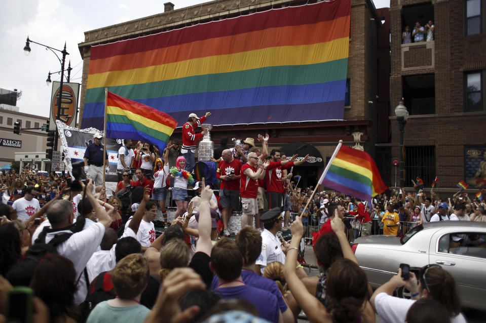 FILE - The Stanley Cup makes an appearance during the Gay Pride Parade in Chicago, Sunday June 27, 2010. At least one National Hockey League team with a Russian player on its roster has decided against wearing special warmup jerseys to commemorate Pride Night because of a Russian law that expands restrictions on activities seen as promoting LGBTQ rights. (AP Photo/Chicago Tribune, William DeShazer, File)