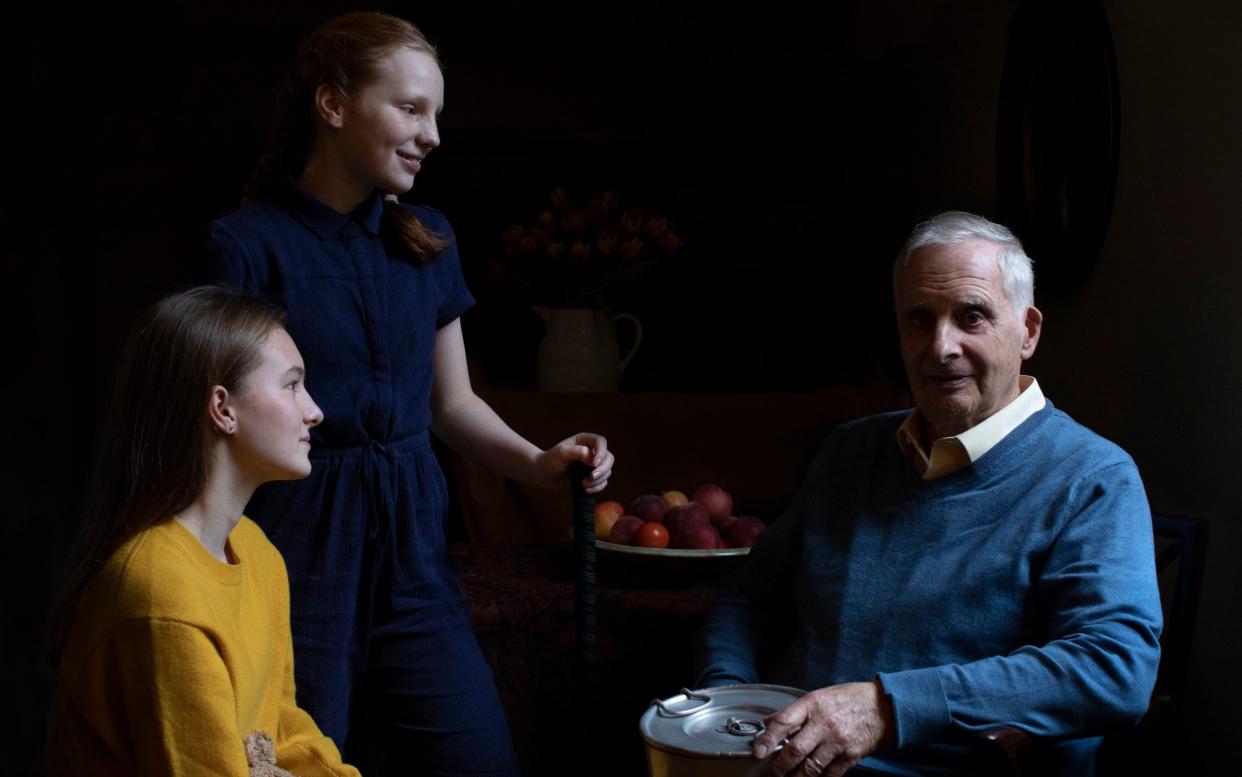 Steven Frank BEM, aged 84, originally from Amsterdam, who survived multiple concentration camps as a child, pictured alongside his granddaughters Maggie and Trixie Fleet, aged 15 and 13 - PA