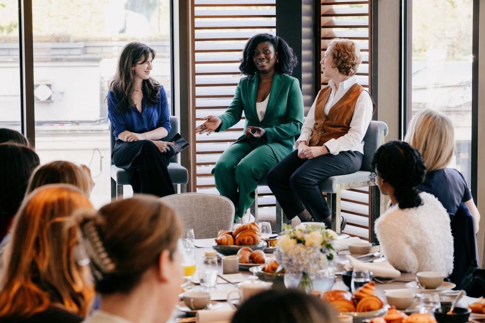 a group of women sitting in chairs