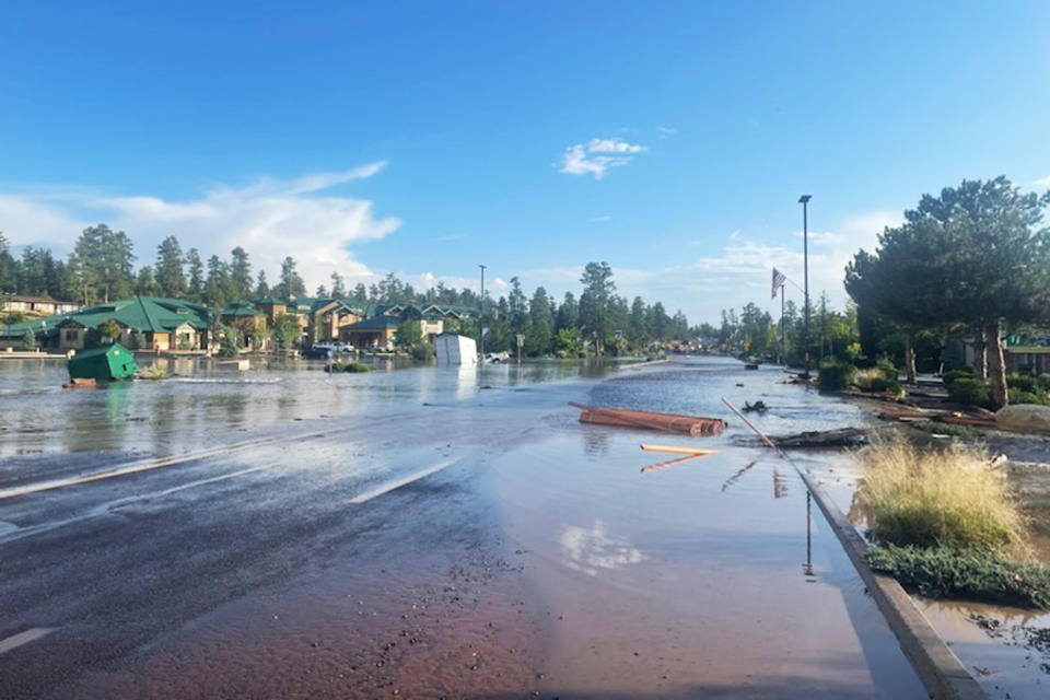 Water and debris along flooded Highway 64 in Tusayan, Ariz., on Tuesday. (Grand Canyon National Park / Facebook)