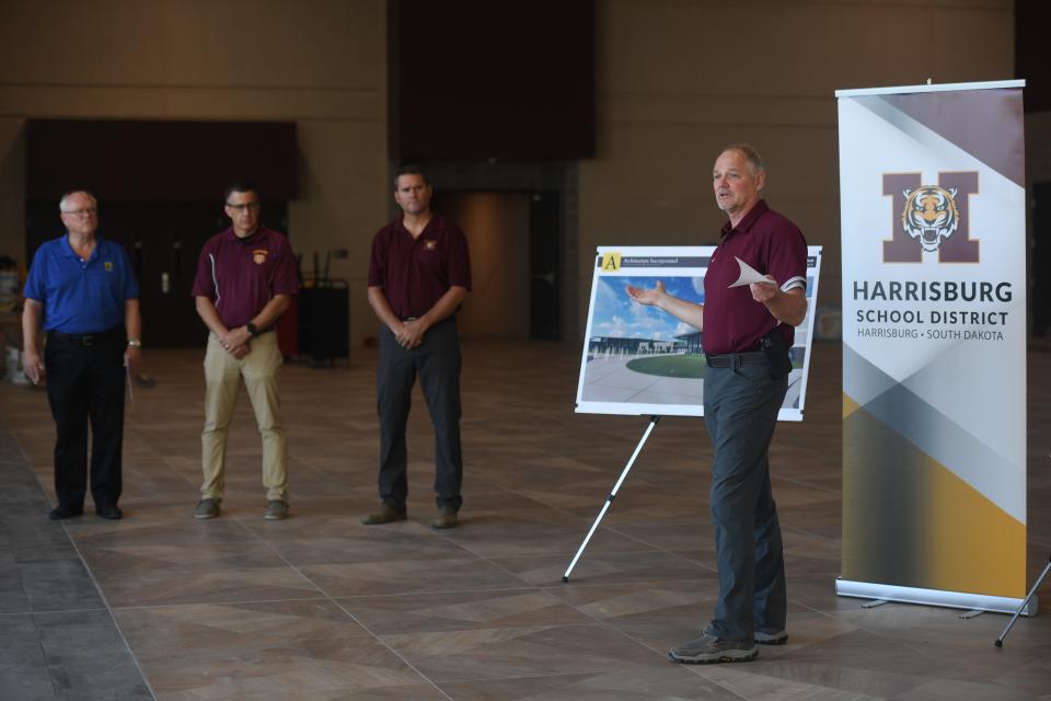 Superintendent Tim Graf talks about Freshman Academy with (left to right) architect Steve Jastram, assistant principal Brad Seamer and principal Ryan Rollingner at Harrisburg Freshman Academy in Sioux Falls, South Dakota on Friday, August 11, 2023.