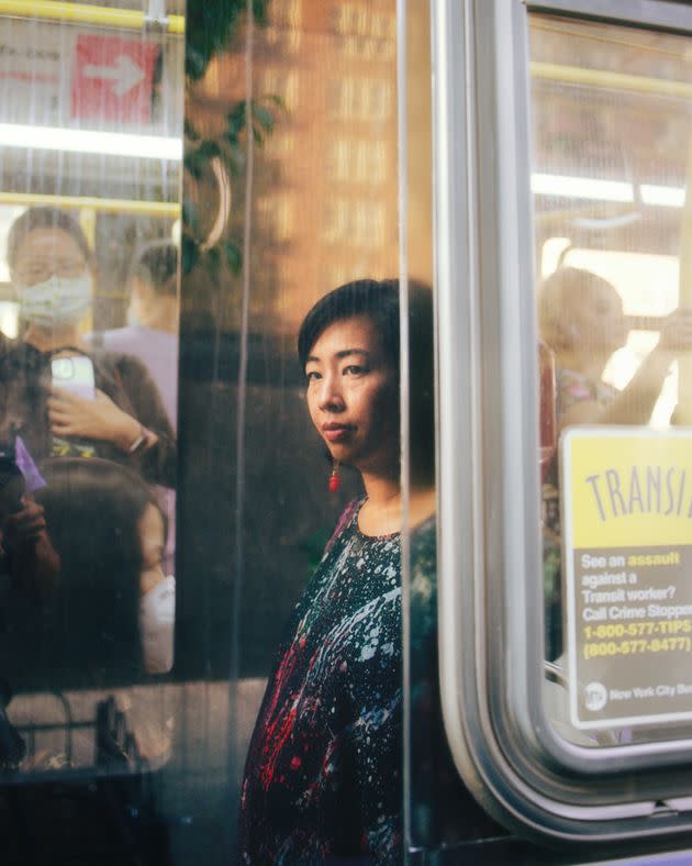 At a photoshoot in Flushing in August, Liu suddenly became emotional while sitting at the bus stop where she used to spend two hours waiting on her commute. (Photo: Justin J Wee for HuffPost)