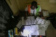 Election official starts to count the ballots during the presidential election in Abidjan