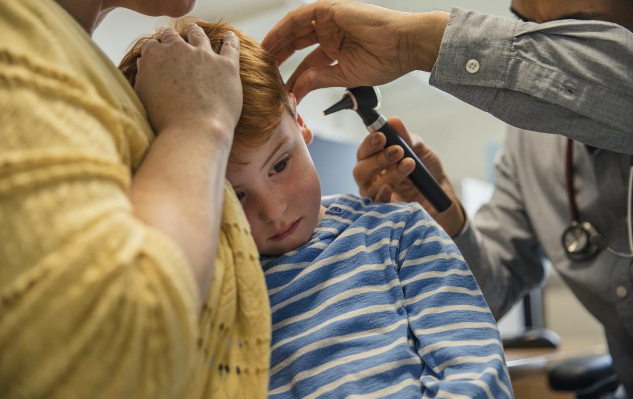 <span class="caption">With a beam of light, an otoscope allows a clinician to examine the ear canal and eardrum.</span> <span class="attribution"><a class="link " href="https://www.gettyimages.com/detail/photo/let-me-see-in-your-ear-royalty-free-image/878336612?adppopup=true" rel="nofollow noopener" target="_blank" data-ylk="slk:SolStock/E+ via Getty Images;elm:context_link;itc:0;sec:content-canvas">SolStock/E+ via Getty Images</a></span>