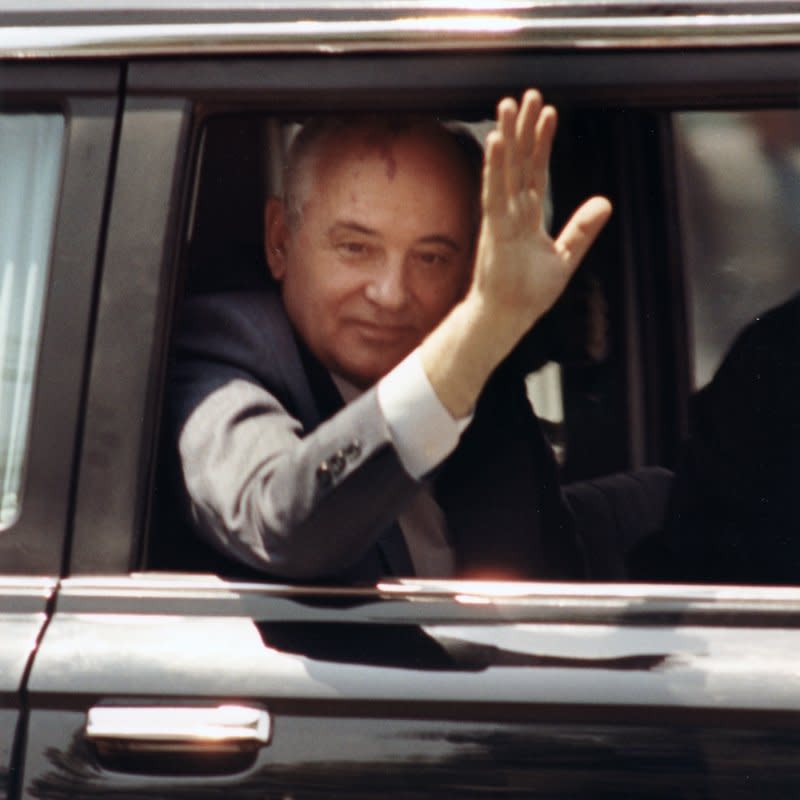 Soviet President Mikhail Gorbachev waves through the open window of his limousine as he travels through downtown Washington, D.C., on June 1, 1990. On February 7, Gorbachev issued a series of reforms and the Communist Party gave up its 70-year monopoly of political power in the Soviet Union. File Photo by Bruce Young/UPI
