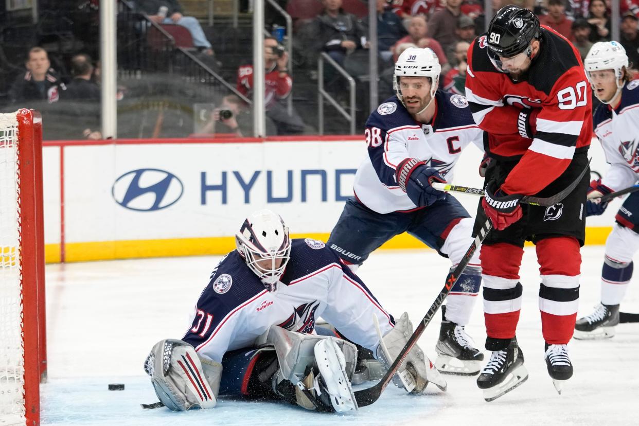 Devils left wing Tomas Tatar scores past Blue Jackets goaltender Michael Hutchinson on Thursday.