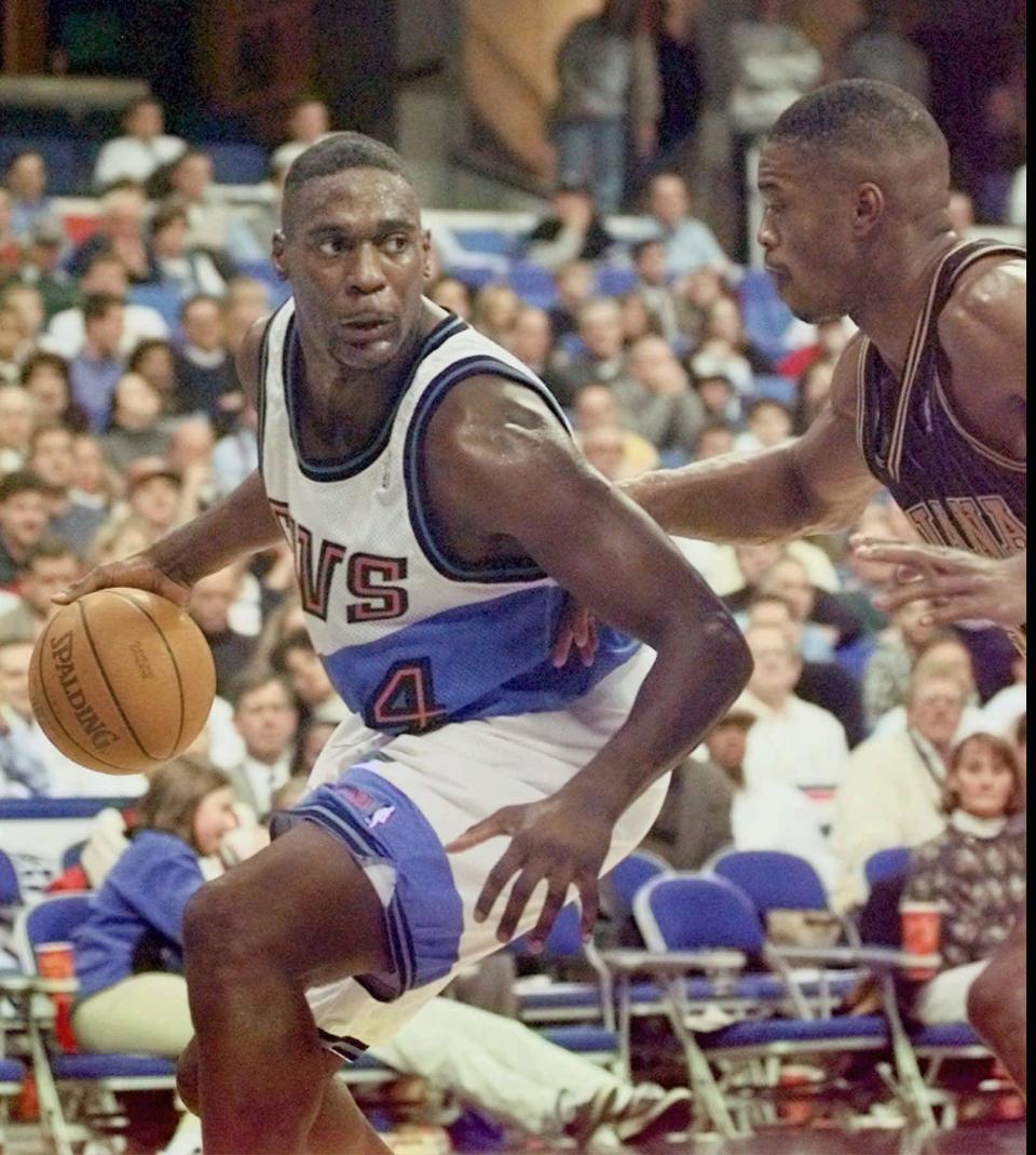 Cleveland Cavaliers forward Shawn Kemp (4) works against Antonio Davis of the Indiana Pacers in the fourth quarter of the Cavaliers' 80-77 win Tuesday night, Nov. 4, 1997, in Cleveland.