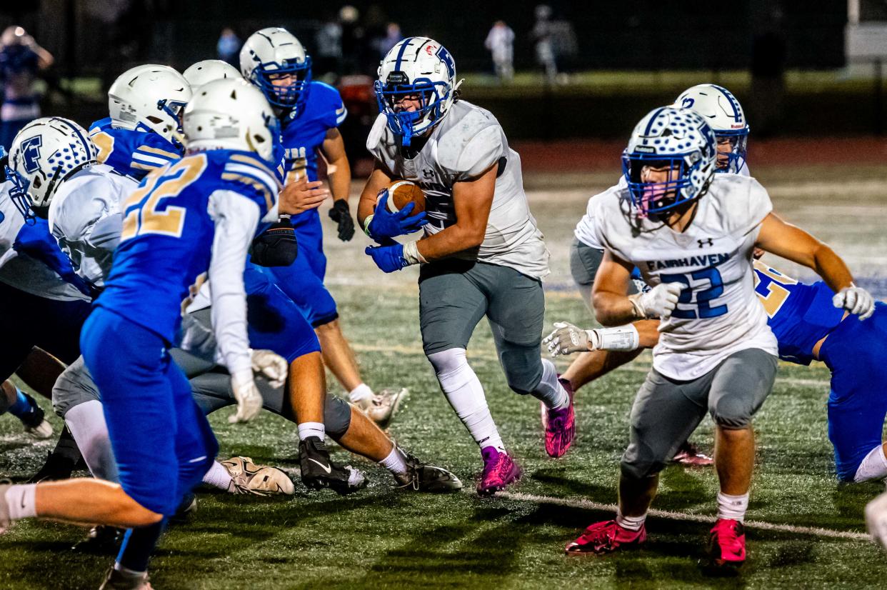 Fairhaven's Justin Marques drives through the offensive line.